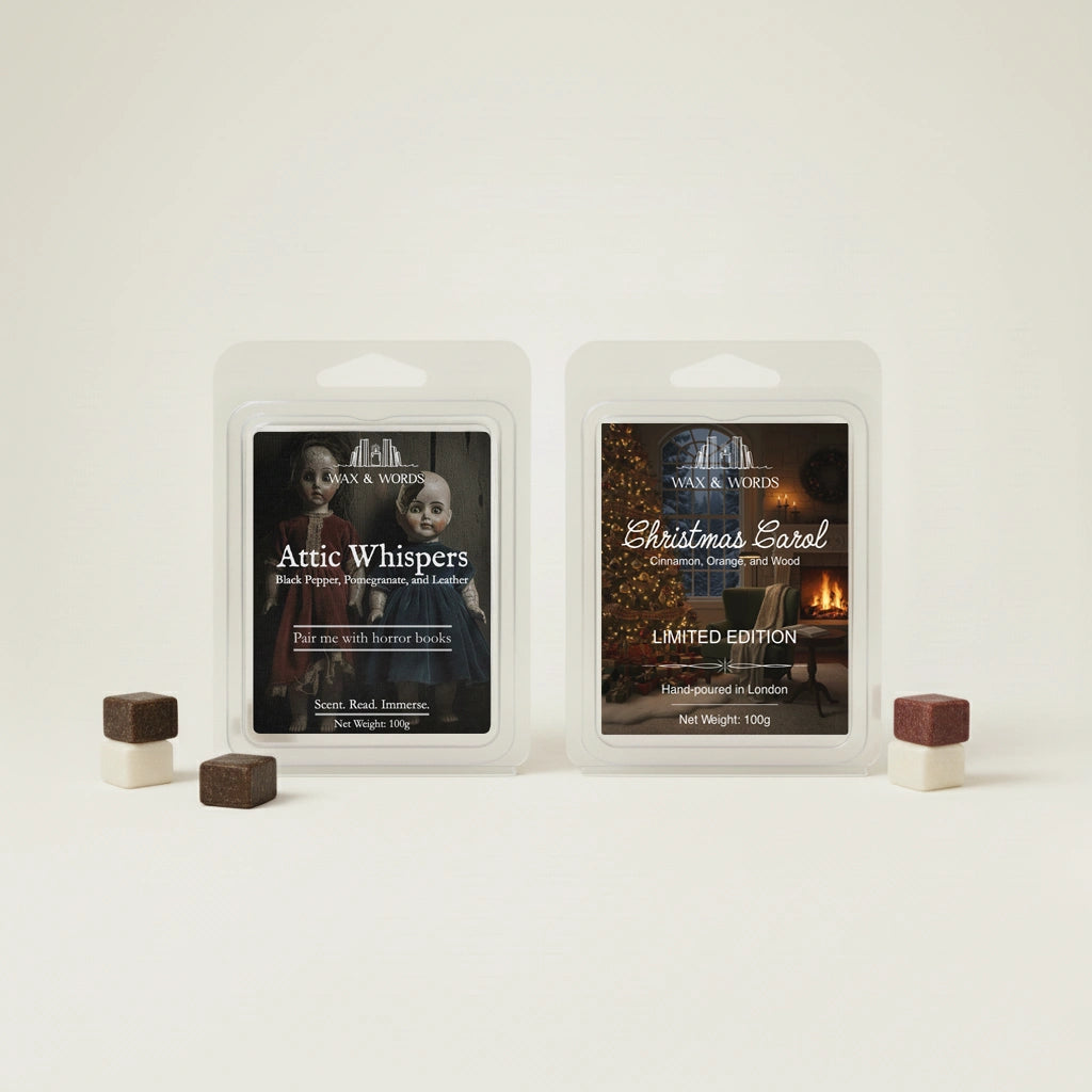 Two wax melts packaging labeled 'Attic Whispers' and 'Christmas Carol' on a white background.