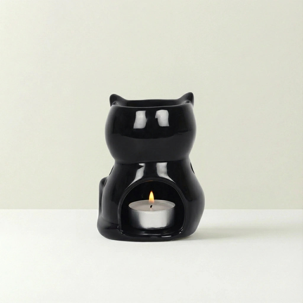 Black cat-shaped container with on a beige background