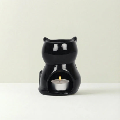 Black cat-shaped container with on a beige background