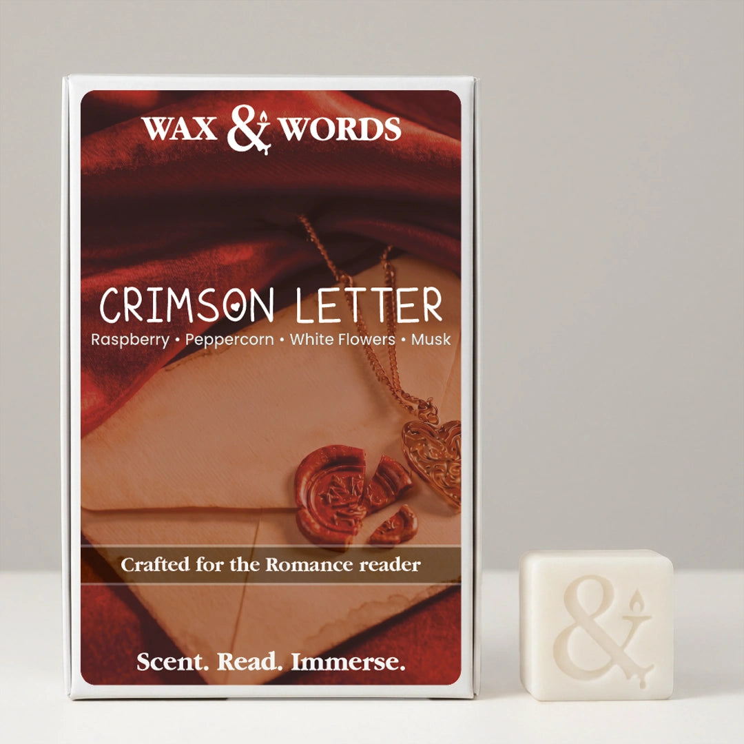 Wax & Words 'Crimson Letter' romance novel book cover shown upright next to a small white wax seal with an ampersand symbol, on a light gray background.