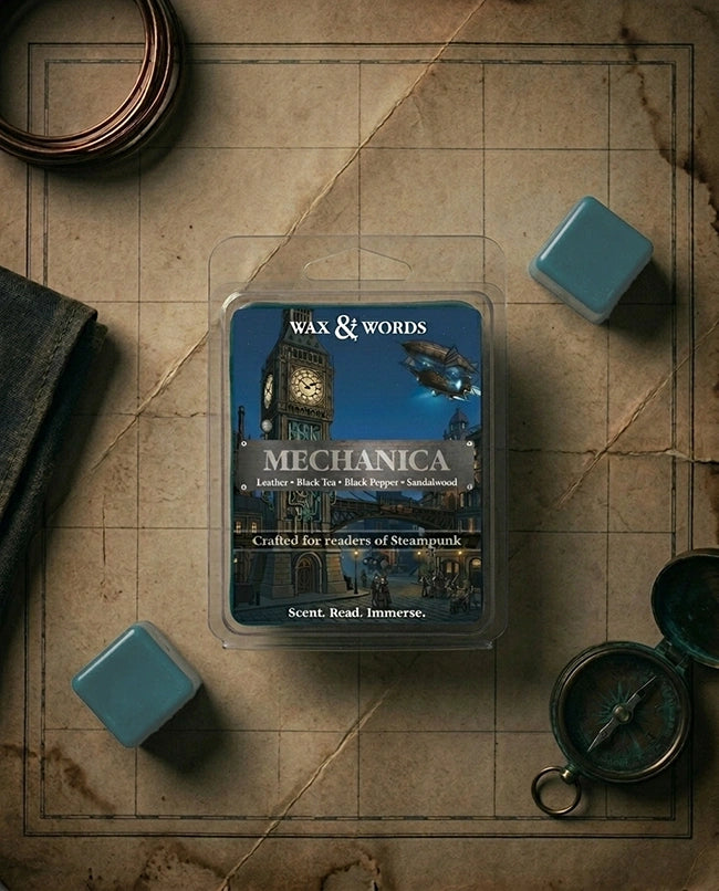 Wax and Words Mechanica wax melt packaging on a map background with dice and a compass.