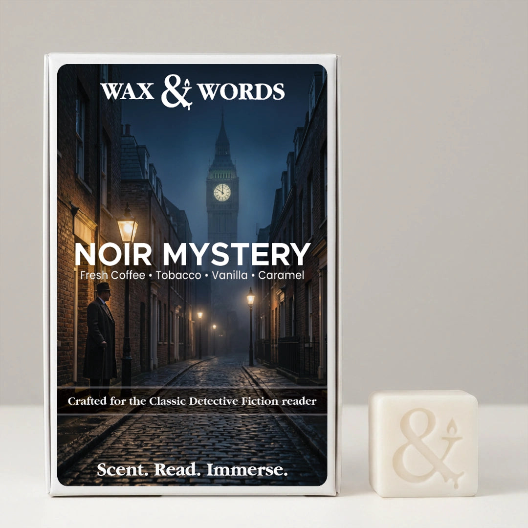 Wax & Words 'Noir Mystery' fragrance box shown upright next to a small off-white wax melt cube with an ampersand symbol, on a light gray background.
