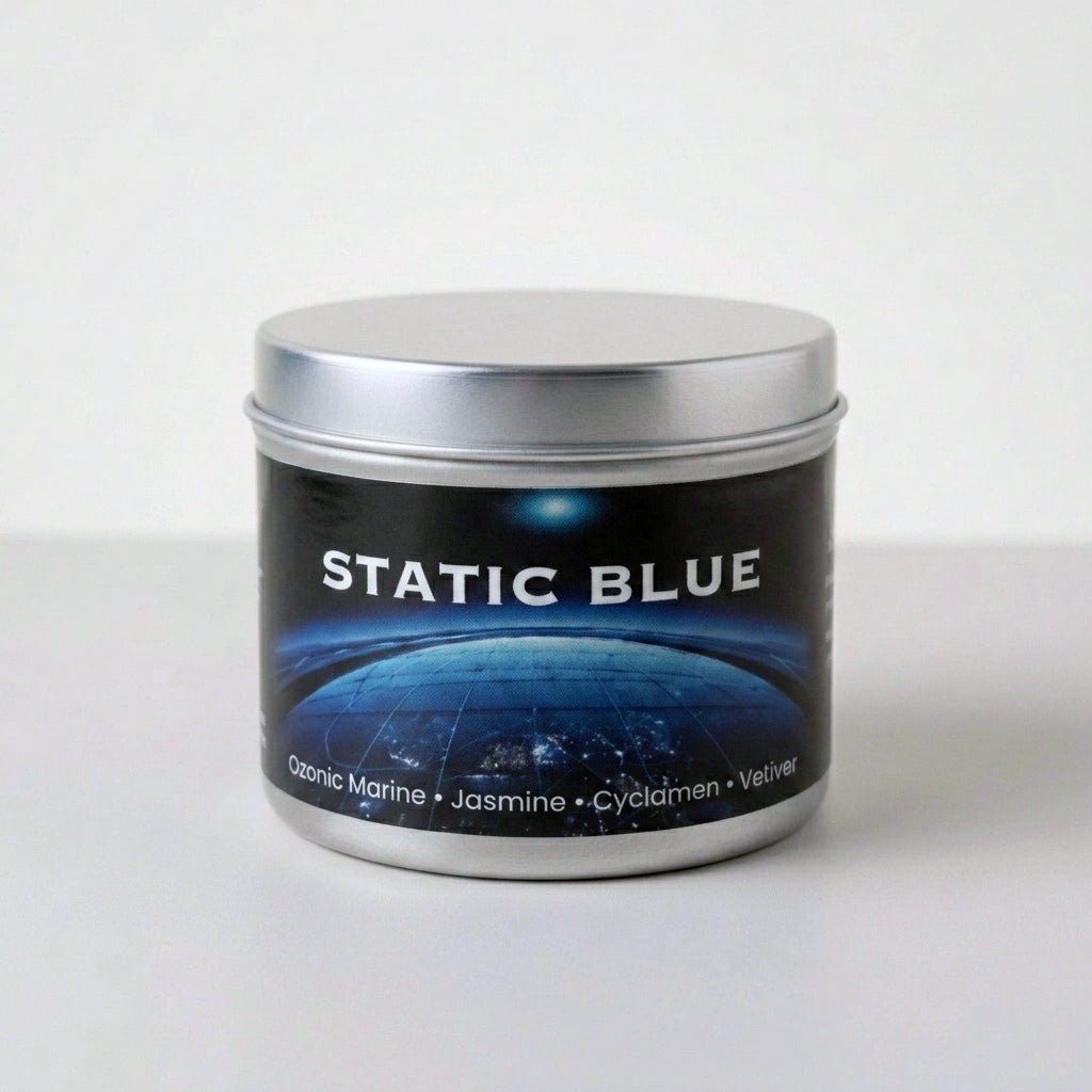 Tin candle labeled 'Static Blue' on a white background