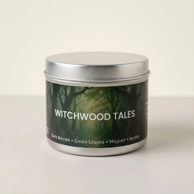 Candle tin labeled 'Witchwood Tales' with a forest design on a white background