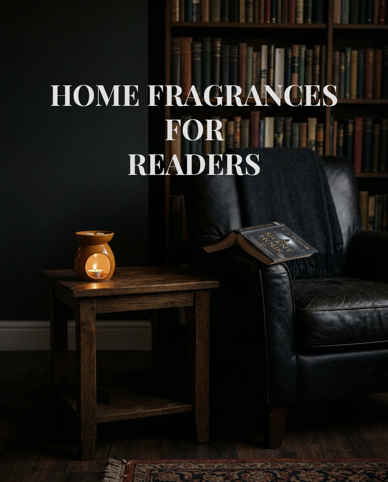 A cozy reading room scene with a black leather armchair, a small wooden side table holding a glowing orange candle holder, and bookshelves in the background. Large white text reads 'HOME FRAGRANCES FOR READERS' across the upper left.